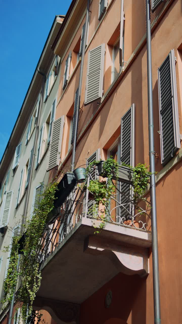 Stylish European Building Facade with Balcony and Ivy