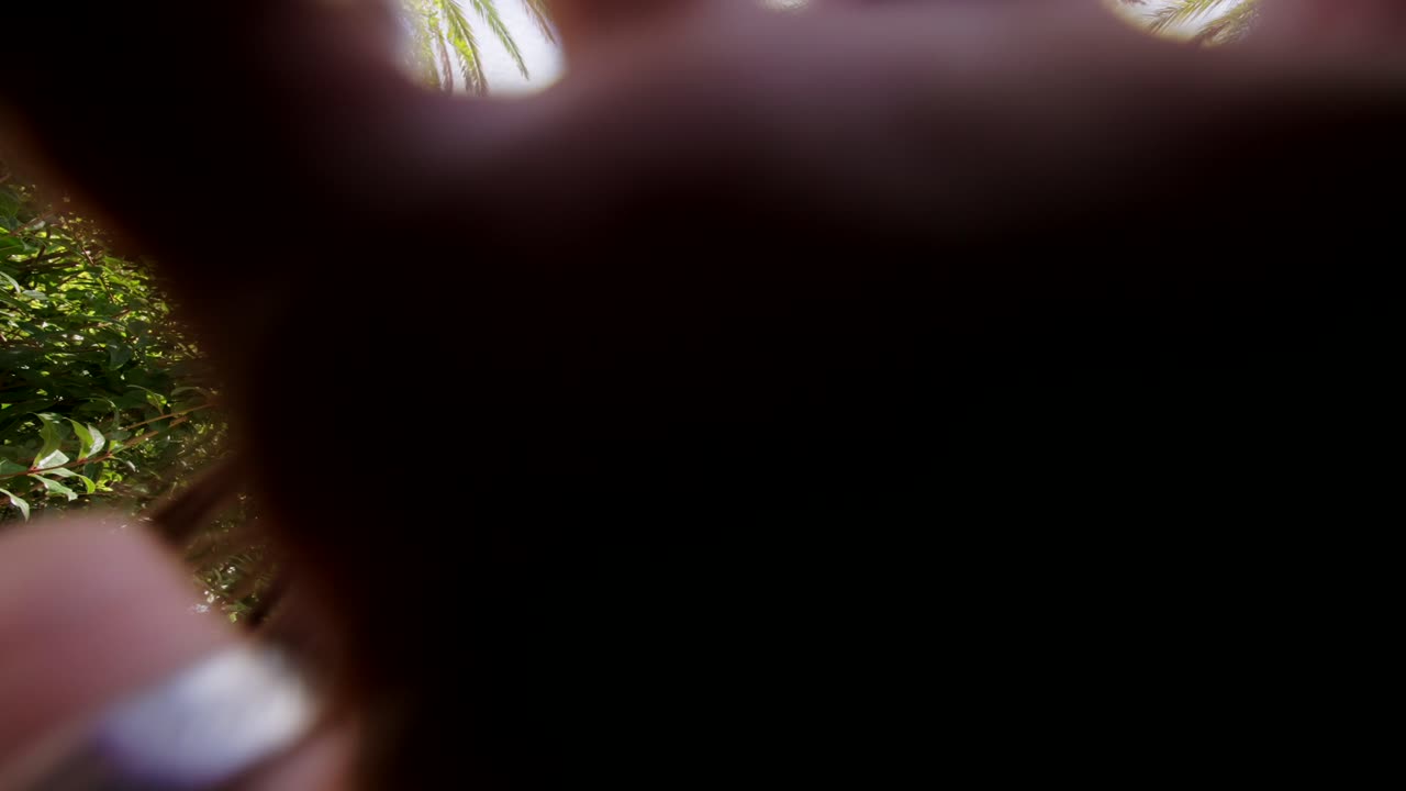 Woman Posing and Gesturing Under Palm Trees