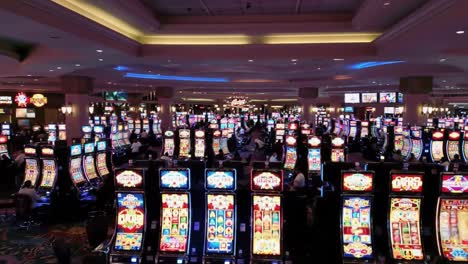 a vibrant casino scene: capturing the lively atmosphere of slot machines, players, and illuminated surroundings in a busy entertainment space