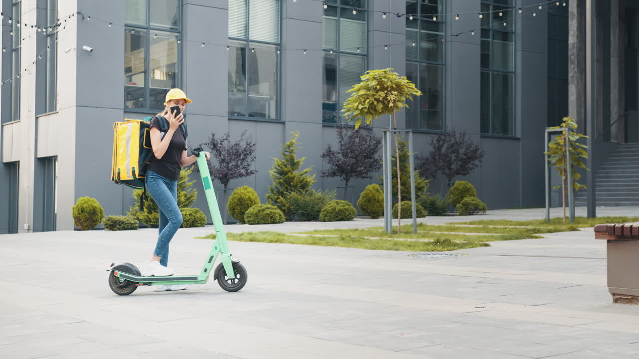 Woman Delivery Person on Electric Scooter