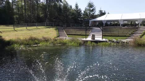 interior of a nice vintage farm in the middle of the forest with a lake and fountain