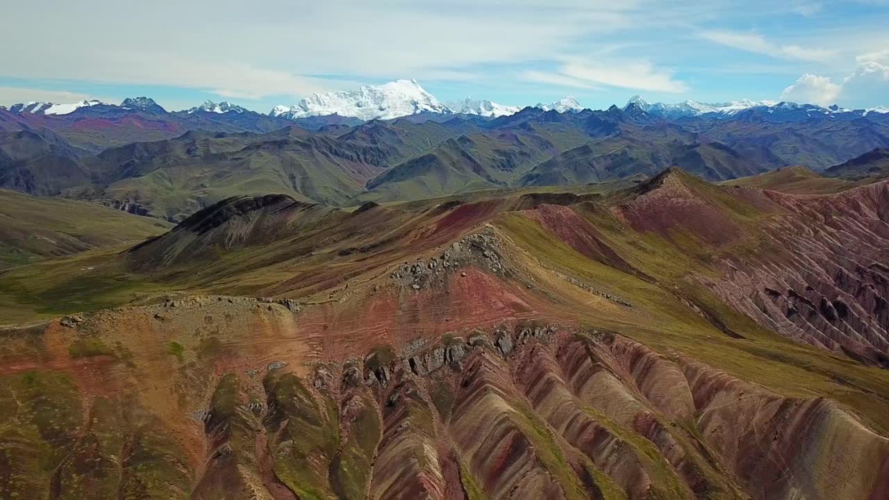 Aerial, reverse, drone shot of red mountains and formations, near Palcoyo, in Valle Rojo Valley, Andes, Peru, South America