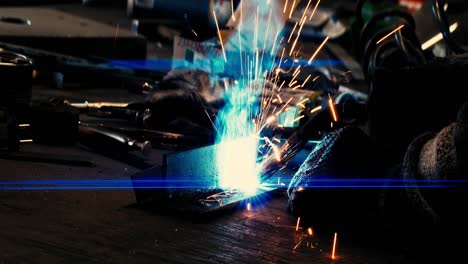 metal welder works with a steel welder in a factory with protective equipment