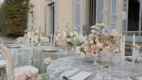 elegant outdoor event table setting with floral arrangements
