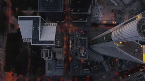 AERIAL:-Breathtaking-Overhead-Top-Down-Birds-View-Shot-of-Frankfurt-am-Main,-Germany-City-Center-Skyline-right-after-Sunset-with-little-Traffic-due-to-Coronavirus-Covid-19-Pandemic