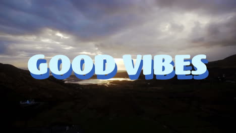 good vibes text over abstract shapes against view of sunset