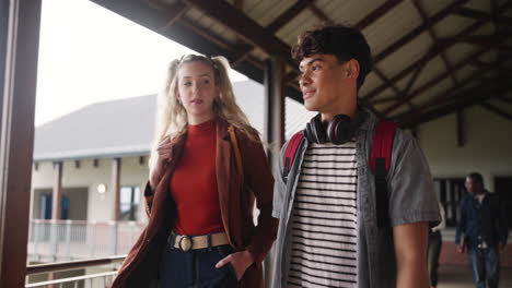 teenage students walking in school hallway