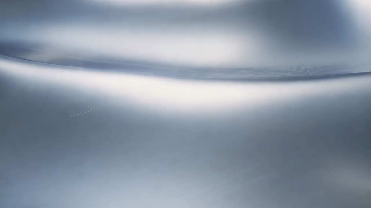 Gliding satin surface shifting specular glints under moving studio light in macro showing creases