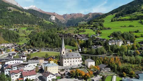 Matrei-in-Osttirol-Church-in-Tyrol,-Hohe-Tauern-National-Park,-Austria---Aerial-4k-Circling