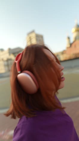 woman listening to music in the city