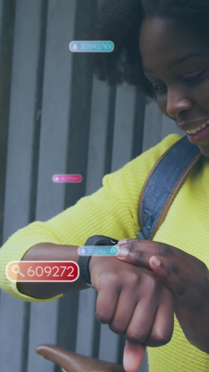 Animation of social media icons and data over african american woman using smartwatch