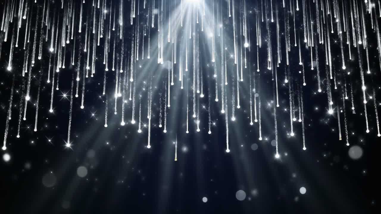 Particelle luminose astratte che cadono con raggi di luce intensa