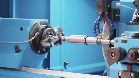metal blank machining process on lathe with cutting or abrasive tool  at steel manufacturing