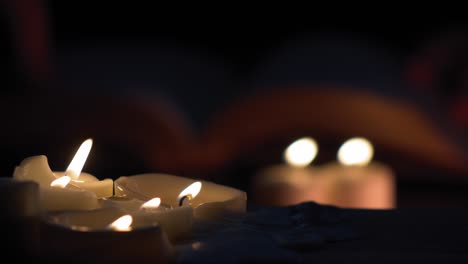 candles burning with book in background 4k