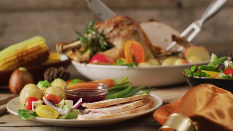 video of plate with potatoes, vegetables and sauce on wooden table