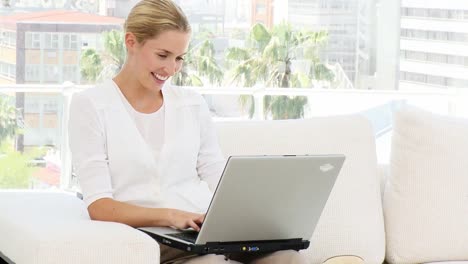 Positive-business-woman-working-at-a-computer