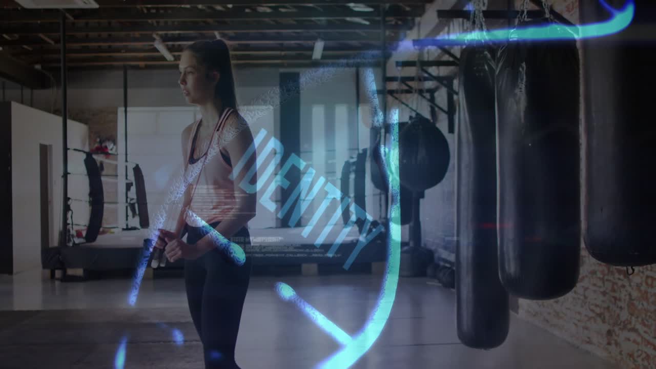 Woman holding jump rope, rotating rope and causing blue trails revealing IDENTITY, prepping workout