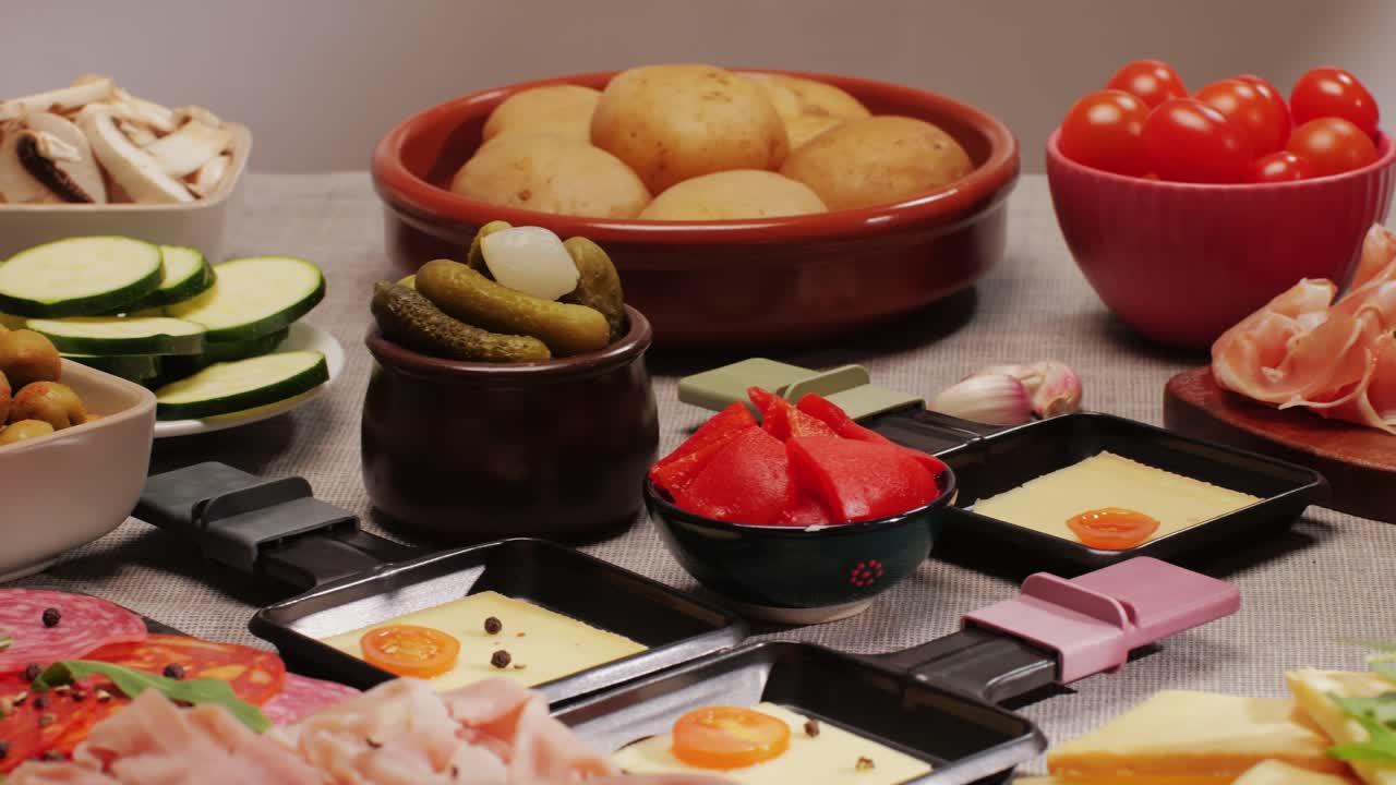 Italian or Spanish restaurant with traditional tapas food, Spanish cuisine, delicious tapas and cheese plate, bruschetta with cheese, olives dry tomatoes and tasty sandwich bar appetizer, buffet