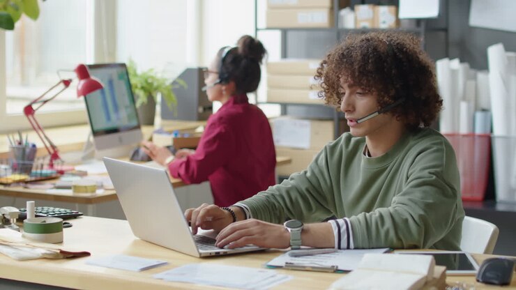 Customer service representatives working in an office