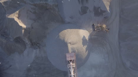 sand coming out of a jib a sand quarrying plant in ontario, canada. payloader at work - aerial