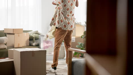 couple embracing in a new home filled with moving boxes