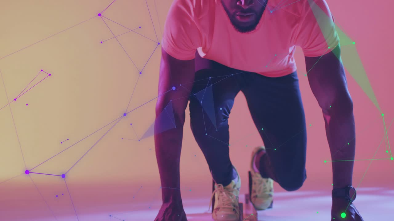 Male athlete adopting sprinter stance, activating sports tech overlay across limbs for performance