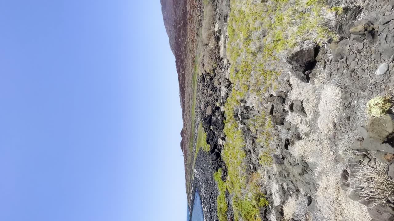 Sea   landscape with mountains on the shores and rocky shores
