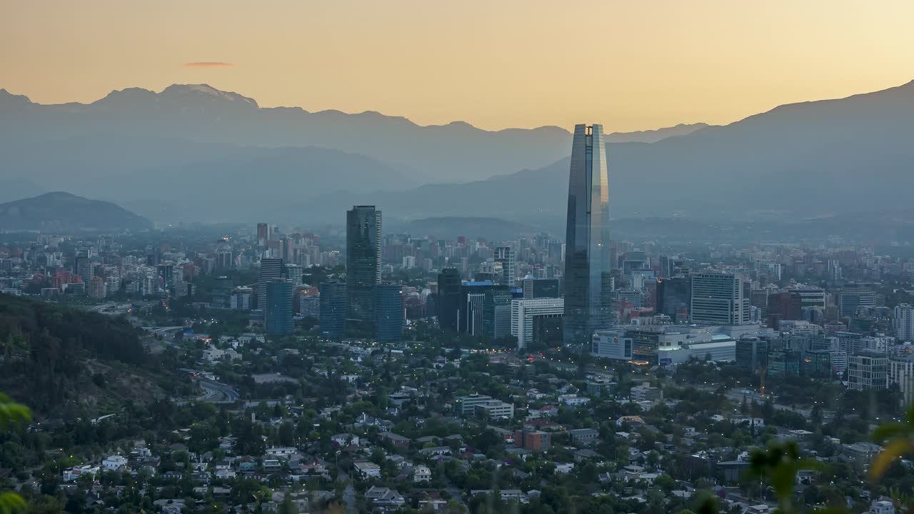 Santiago, Chile financial district with Andes mountain range in background, dawn time lapse