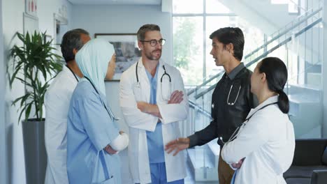 doctors talking by stairs in a hospital 4k