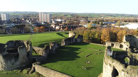 ancient flint castle medieval heritage military welsh ruins aerial view landmark close pull away to right