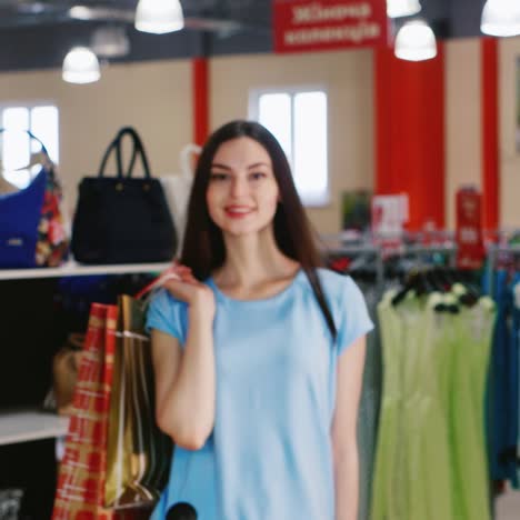 Woman--Holding-Shopping-Bags