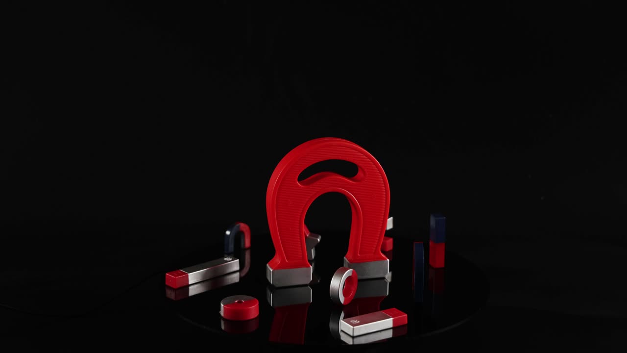 Magnets spinning and interacting on a surface