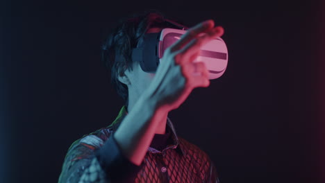 man wearing vr headset in neon light