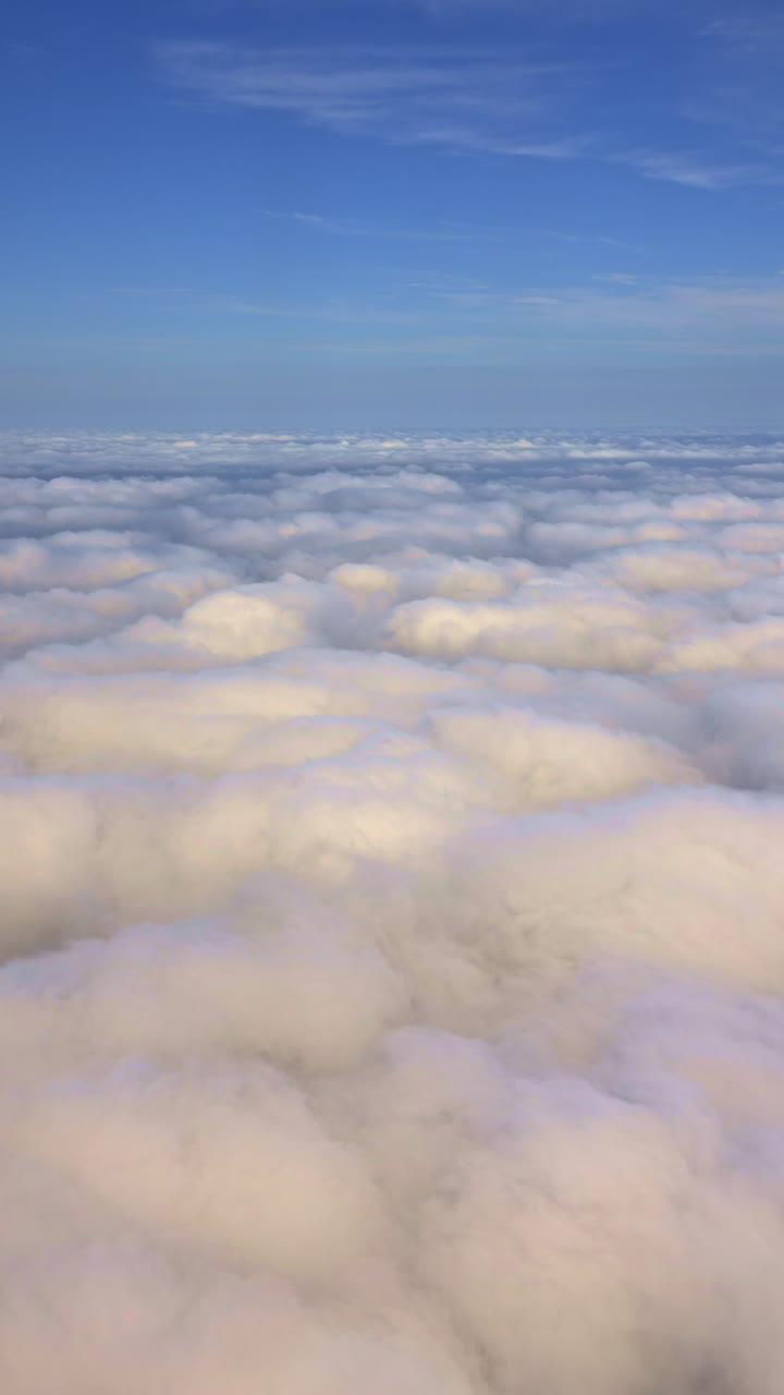 Aerial View Flying Above a Sea of Fluffy White Clouds