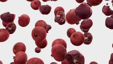 falling pomegranate on a white background