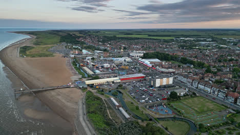 a seaside resort with a rich history and a vibrant present is seen from above in aerial view of skegness