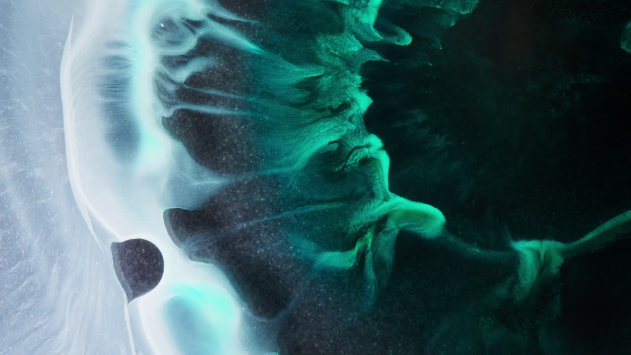 Abstract pattern in blue and black tones with flowing alcoholic ink details