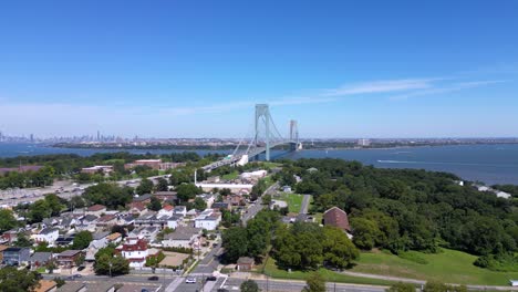 stunning aerial view of staten island and the verrazzano-narrows bridge with a clear skyline, waterfront, and residential neighborhoods under a bright blue sky