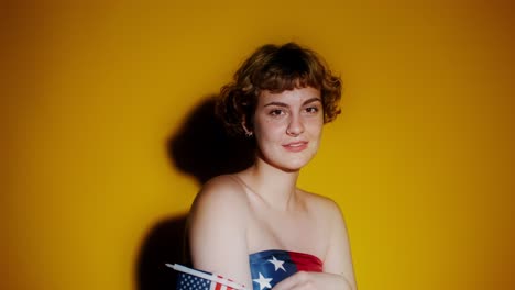 woman holding american flags