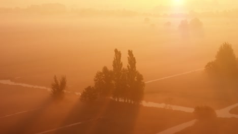 misty sunrise over a rural landscape