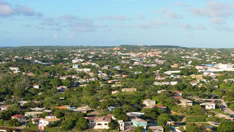 wide angle aerial overview of homes in a tropical climate on sunny blue sky day