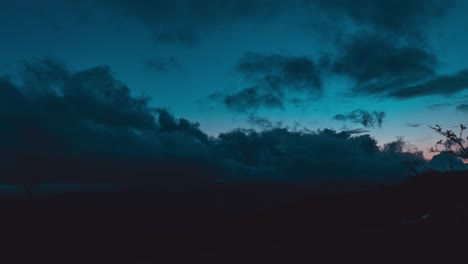 aerial timelapse view of dark clouds during sunset