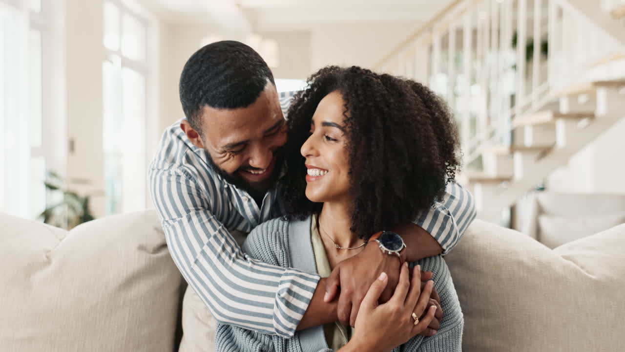 Happy Couple Embracing on Sofa