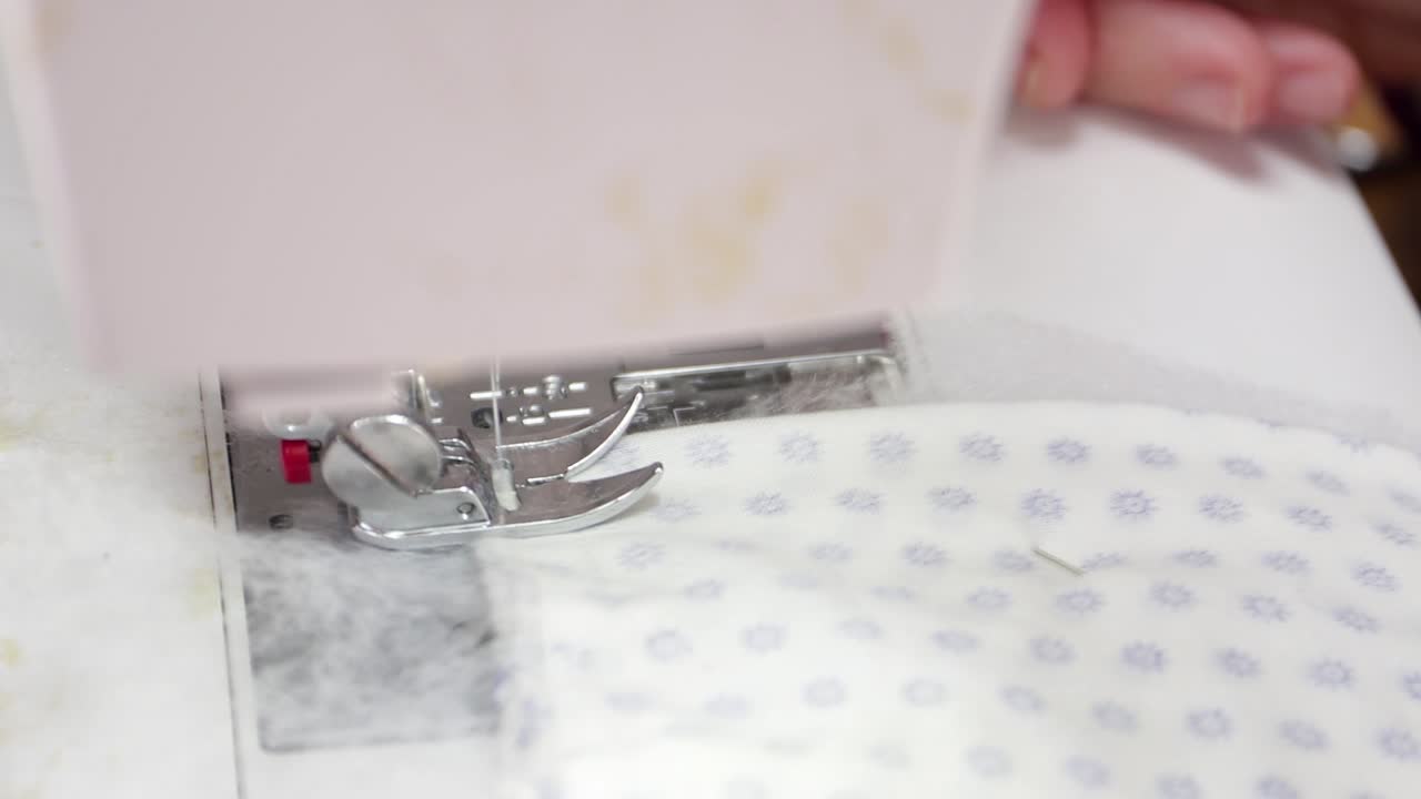 A Presser Foot Of A Sewing Machine Used By A Seamstress In Making Facemasks At Home During Coronavirus Outbreak - Closeup Shot