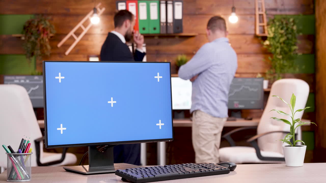 Office workspace with computer and people