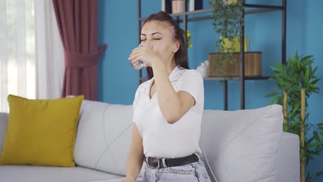 young woman drinking water for healthy life.