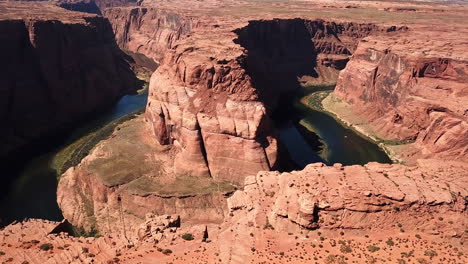 aerial shot of horseshoe bend in the arizona desert, tourists at the landmark destination