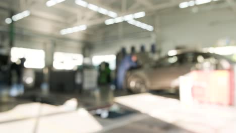 blurry image of a car repair shop