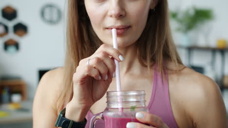 woman drinking a smoothie
