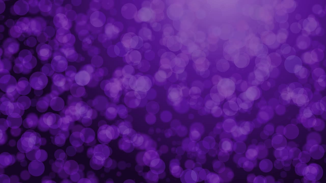 el video de fondo de 4k es de color púrpura bokeh brillante